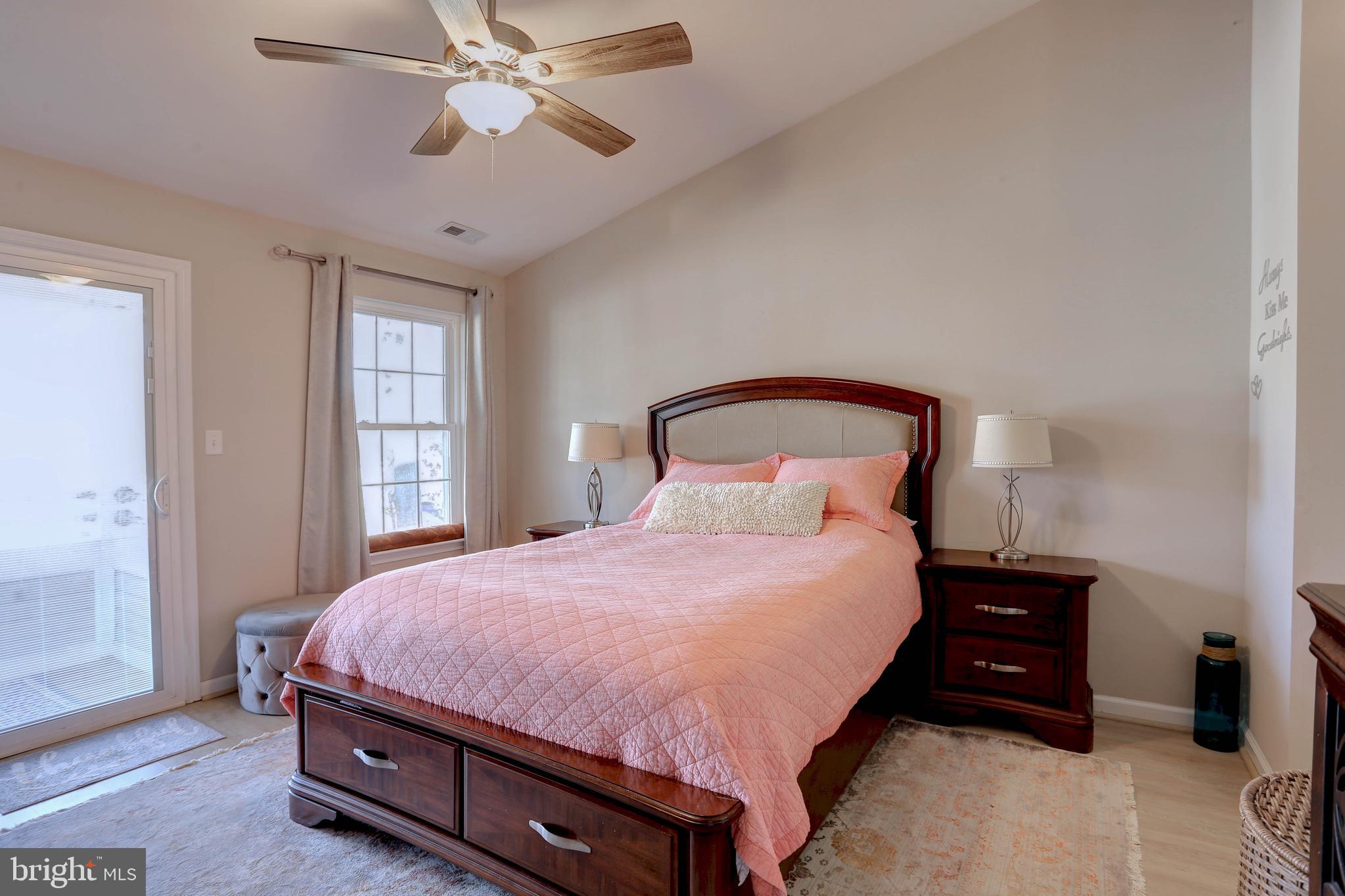 602 Moonglow Road, Unit 302 Odenton, MD 21113 - Photo 17 of 24 a bedroom with a bed and a chandelier