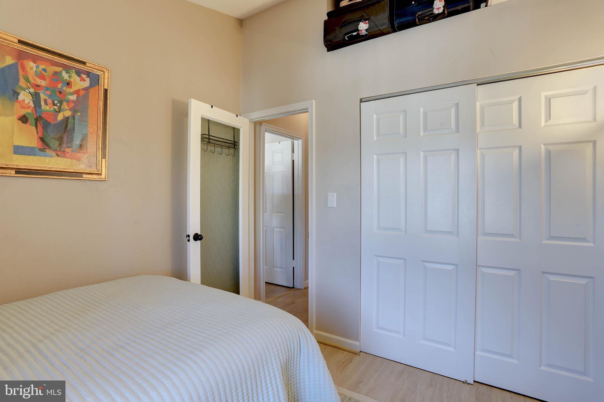 602 Moonglow Road, Unit 302 Odenton, MD 21113 - Photo 20 of 24 a bedroom with a bed and cabinets