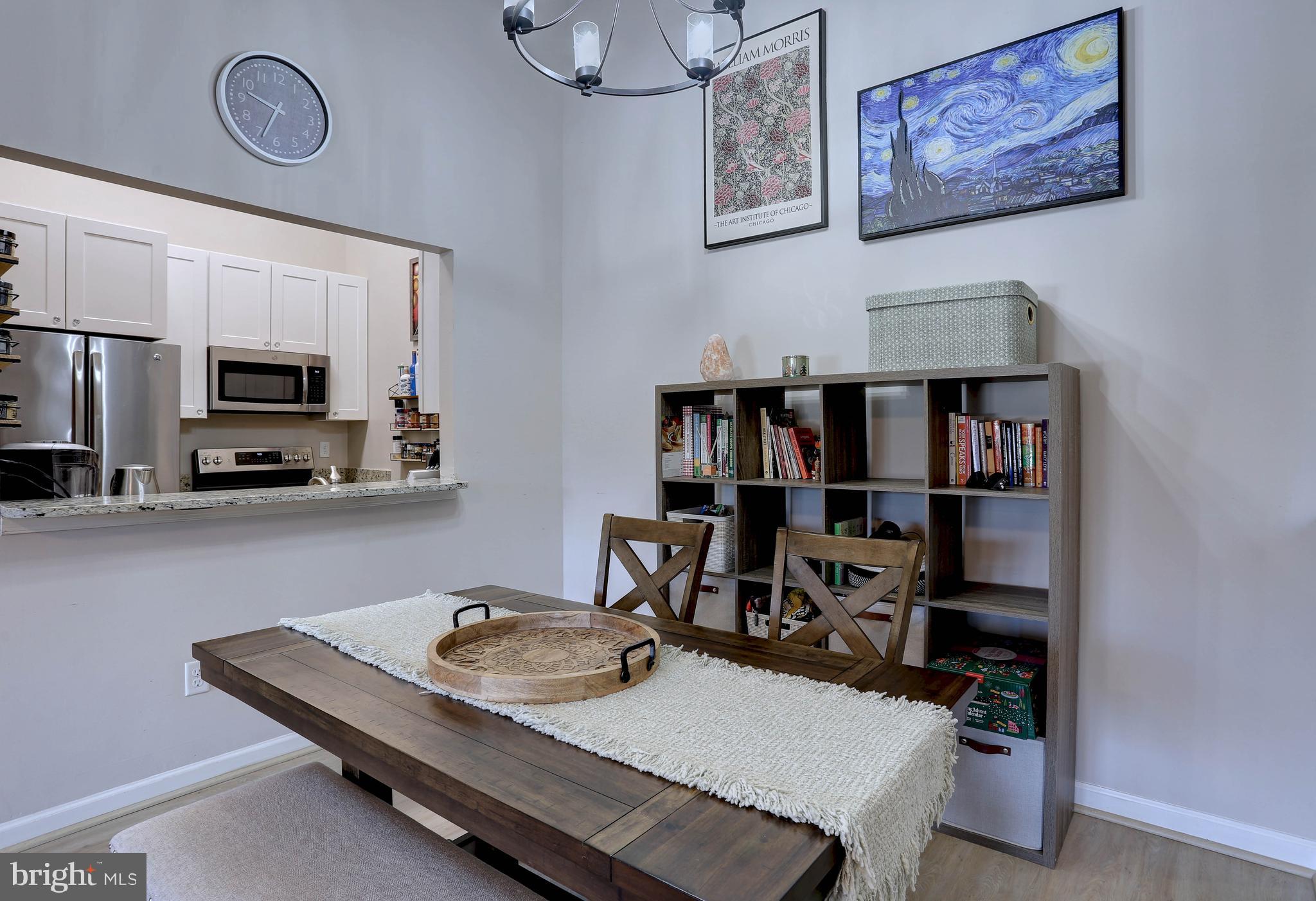602 Moonglow Road, Unit 302 Odenton, MD 21113 - Photo 7 of 24 a living room with furniture and a kitchen view