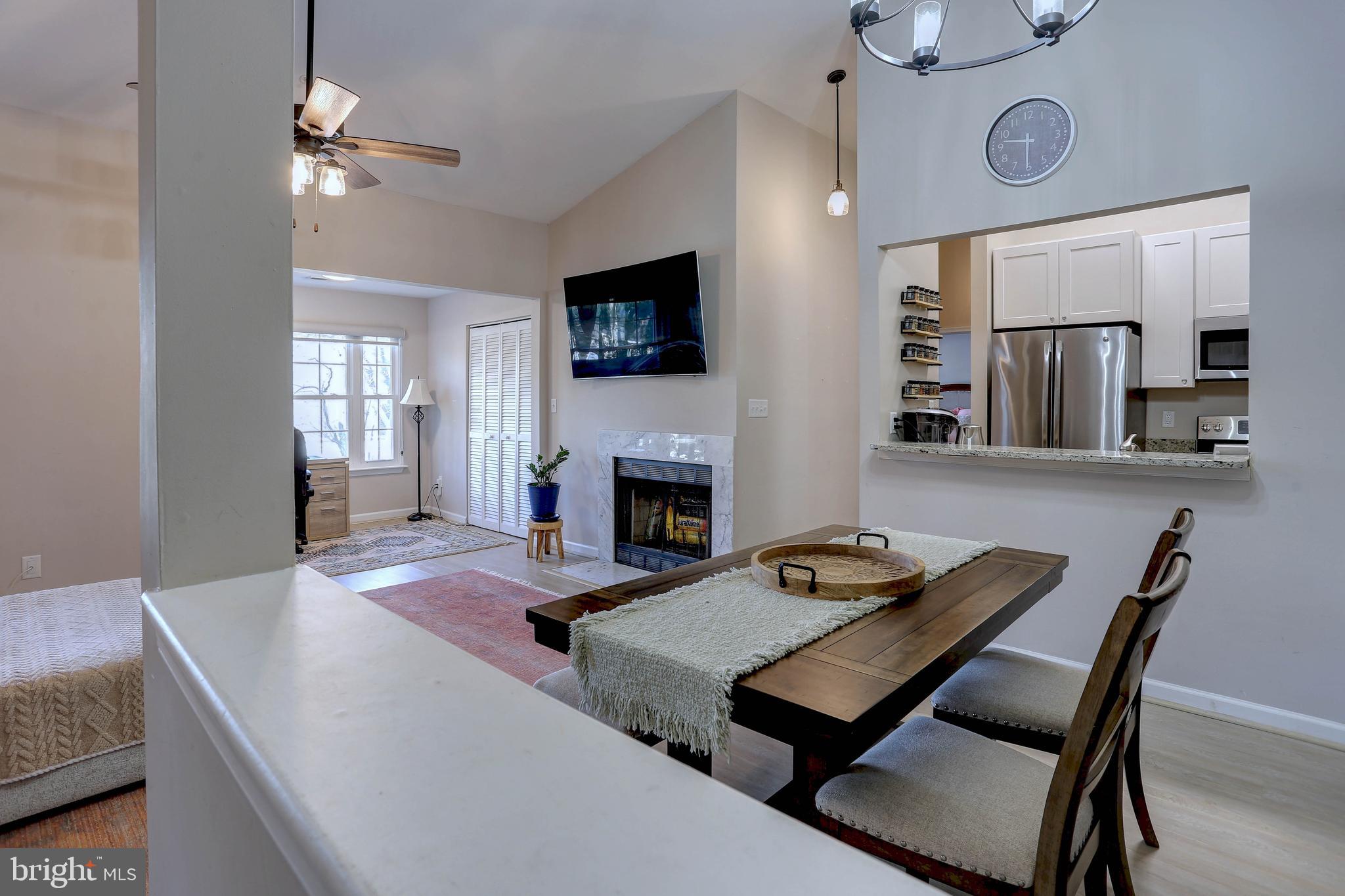 602 Moonglow Road, Unit 302 Odenton, MD 21113 - Photo 8 of 24 a living room with furniture and a fireplace