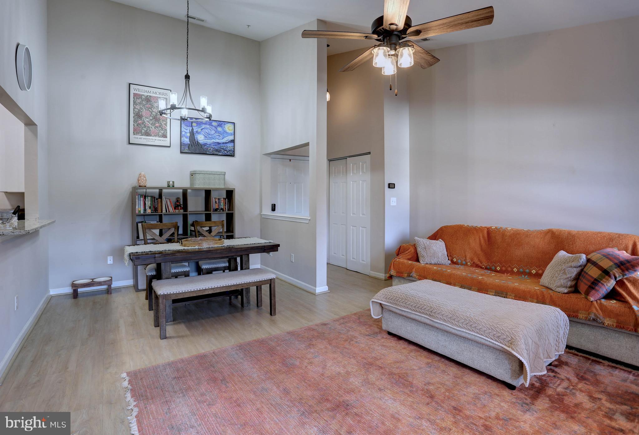 602 Moonglow Road, Unit 302 Odenton, MD 21113 - Photo 9 of 24 a living room with furniture and a chandelier