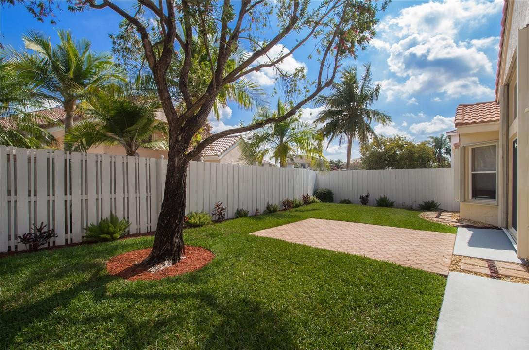 17445 Southwest 33rd Court Miramar, FL 33029 - Photo 14 of 23 a backyard of a house with lots of green space