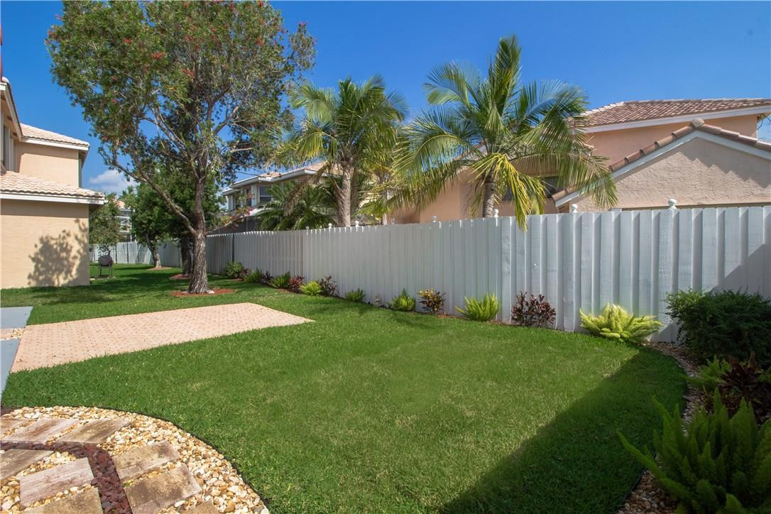 17445 Southwest 33rd Court Miramar, FL 33029 - Photo 15 of 23 a garden with palm trees