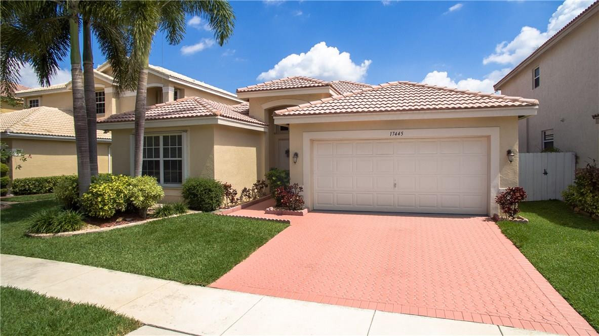 17445 Southwest 33rd Court Miramar, FL 33029 - Photo 16 of 23 a front view of a house with a garden and entryway