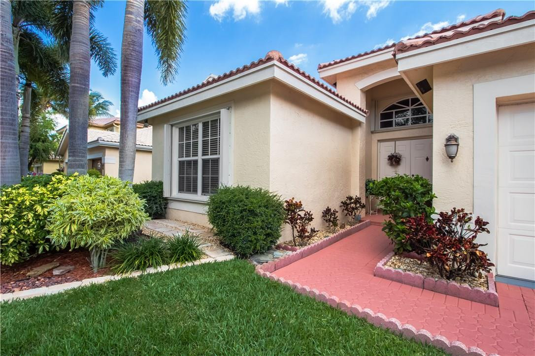 17445 Southwest 33rd Court Miramar, FL 33029 - Photo 18 of 23 a front view of a house with a yard