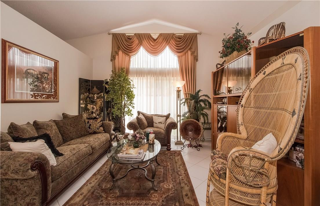 17445 Southwest 33rd Court Miramar, FL 33029 - Photo 3 of 23 a living room with furniture and a wooden floor