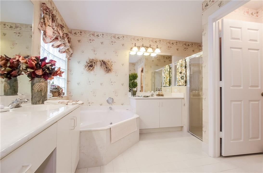 17445 Southwest 33rd Court Miramar, FL 33029 - Photo 6 of 23 a bathroom with a sink mirror and a bathtub