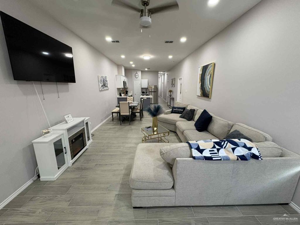 2007 Cassandra Street Mission, TX 78572 - Photo 2 of 10 a living room with furniture and a flat screen tv