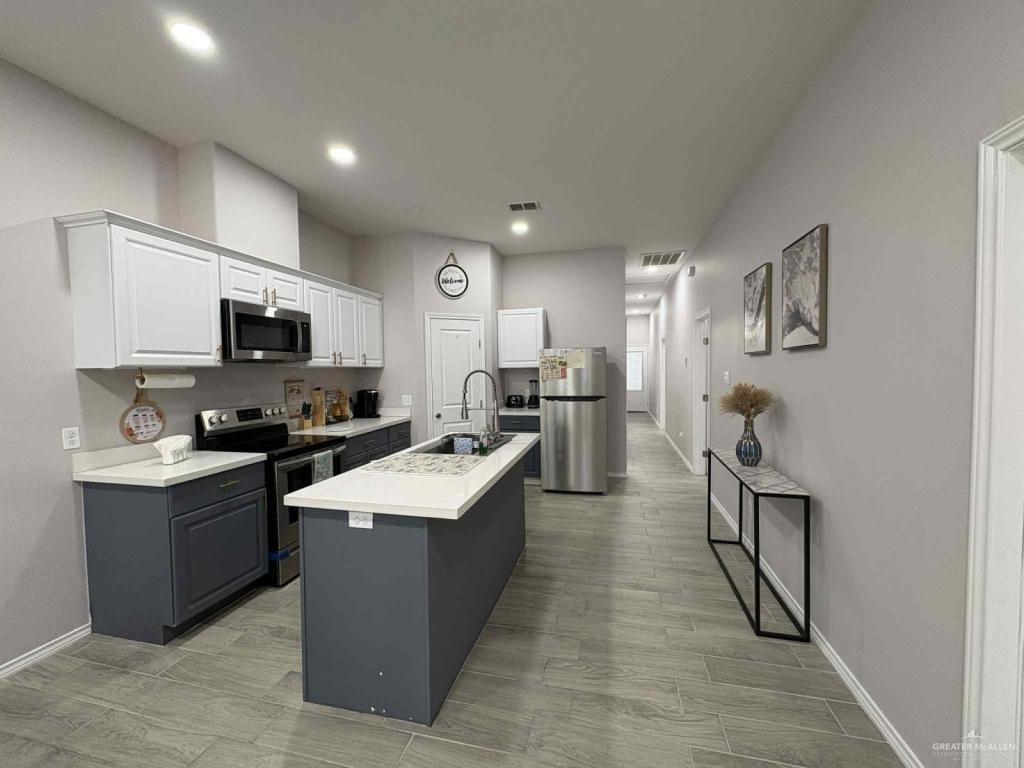 2007 Cassandra Street Mission, TX 78572 - Photo 3 of 10 a large kitchen with stainless steel appliances lots of counter space