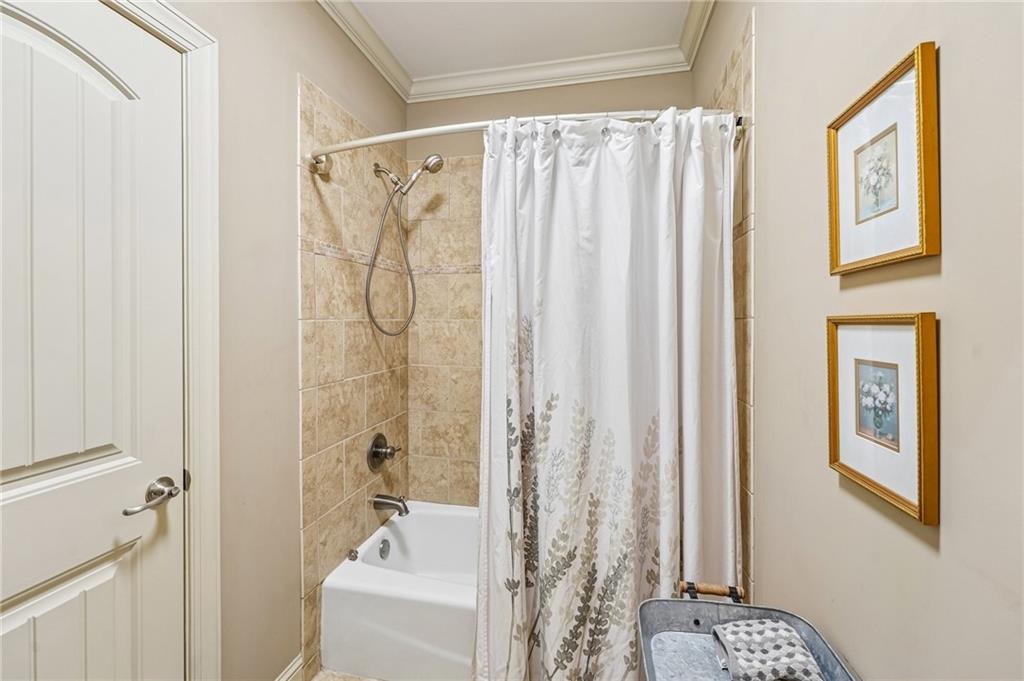 189 Red Trillium Ridge Big Canoe, GA 30143 - Photo 63 of 98 a bathroom with a shower curtain and a window