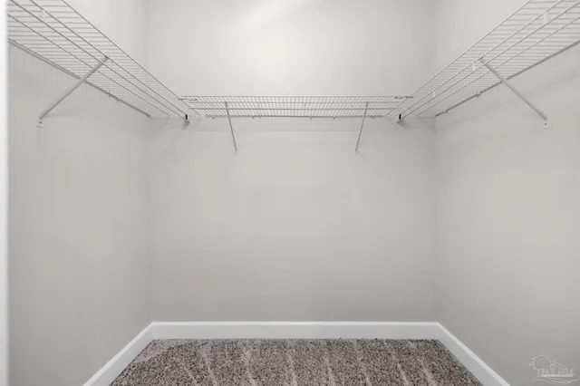 a view of a room with racks on the wall