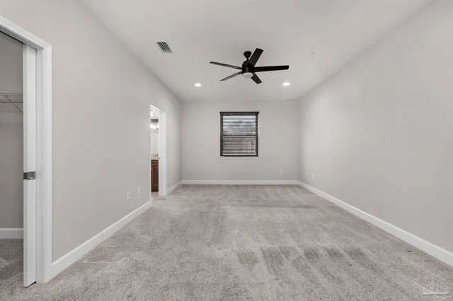 a view of a big room with carpet