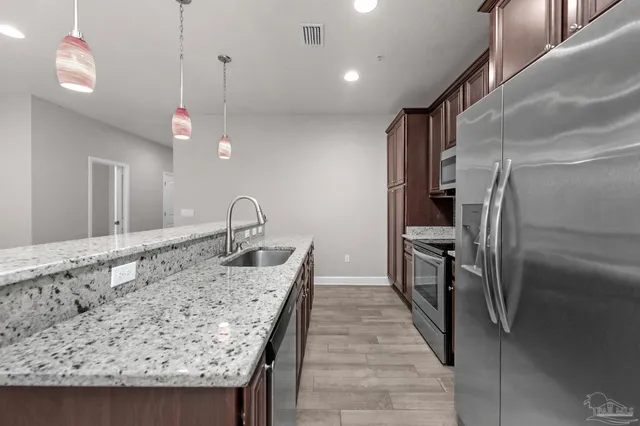 a very nice looking dining room with a table and chairs