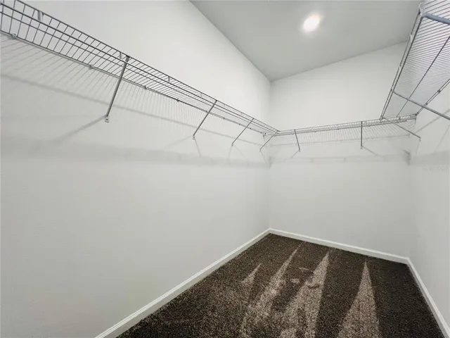 a view of a room with racks on the wall