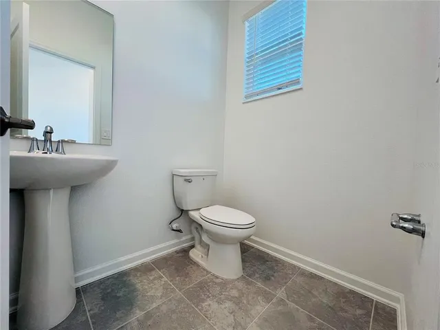 a bathroom with a toilet and a sink