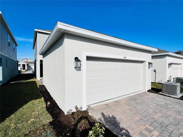 a backyard of a house with barbeque oven