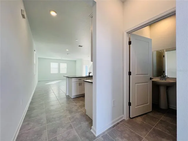a view of a refrigerator in a kitchen
