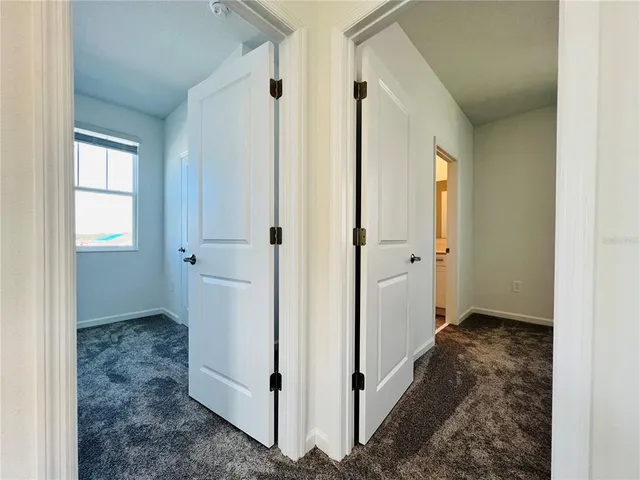 a view of a bathroom with white walls