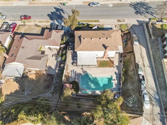 an aerial view of residential houses with outdoor space
