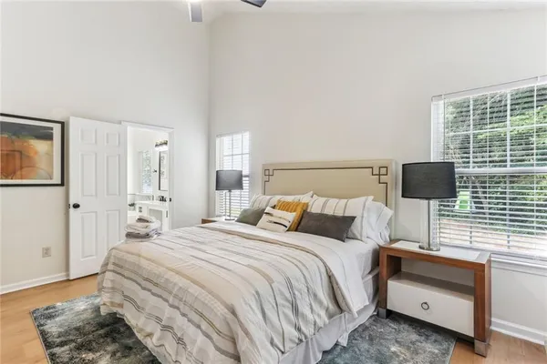 a bedroom with a bed and a night stand