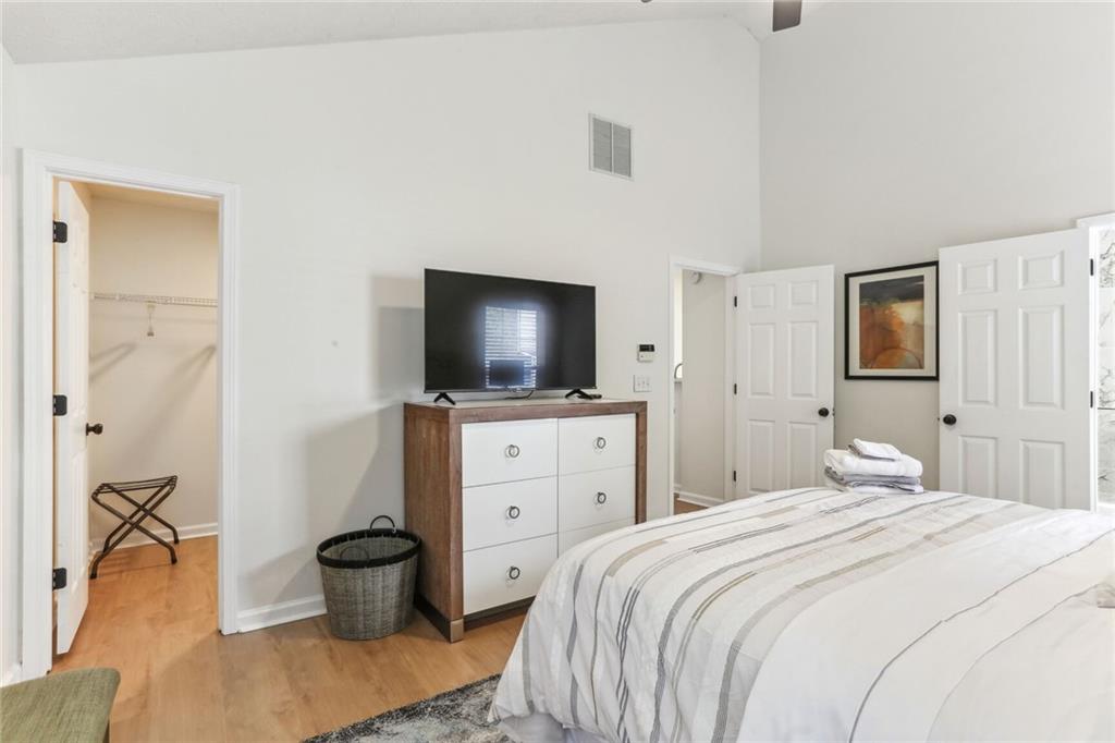 859 Springchase Drive Austell, GA 30168 - Photo 15 of 28 a bedroom with a bed and a flat screen tv