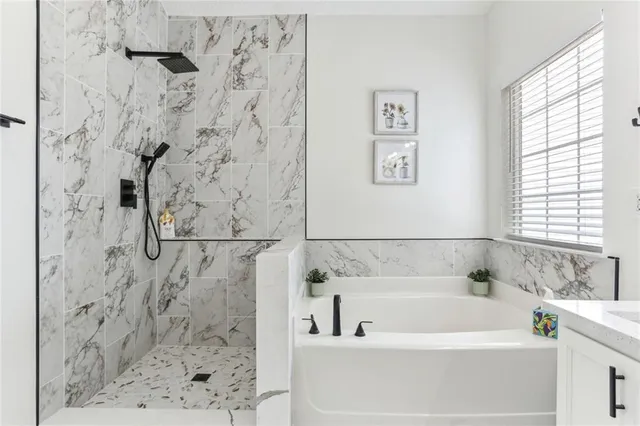 a bathroom with a shower and a bathtub