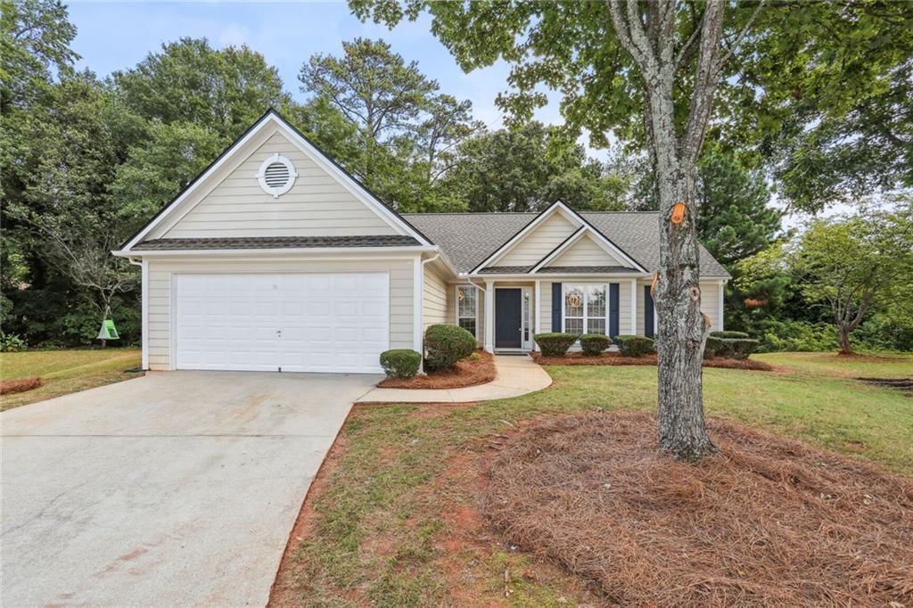 859 Springchase Drive Austell, GA 30168 - Photo 2 of 28 a front view of a house with yard and green space