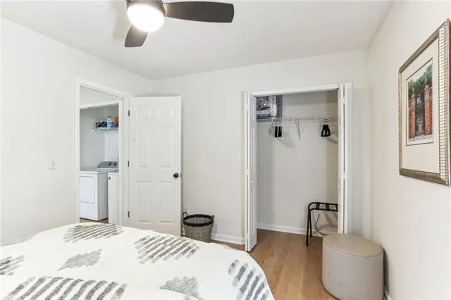 a bedroom with a bed and a chair