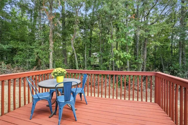 a view of balcony with furniture and trees