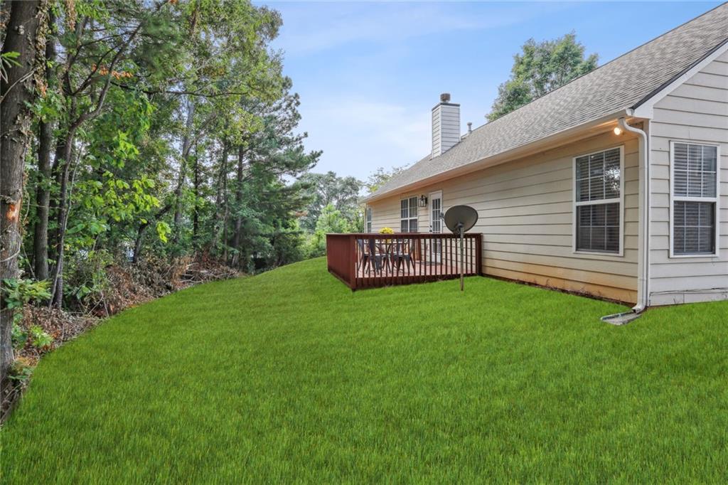 859 Springchase Drive Austell, GA 30168 - Photo 27 of 28 a front view of a house with garden