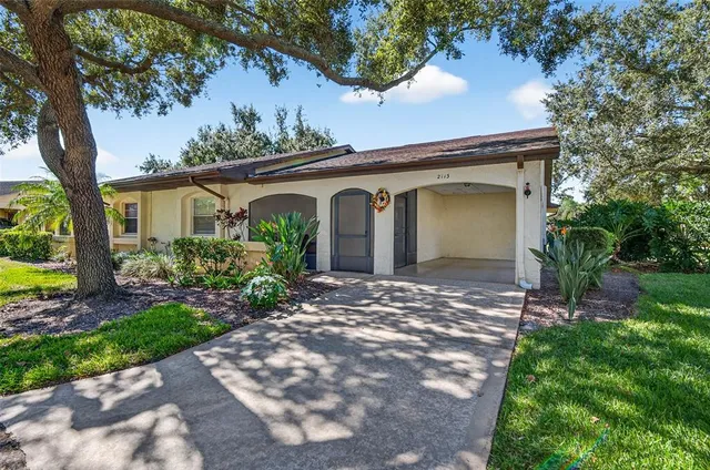 a view of a house with a yard