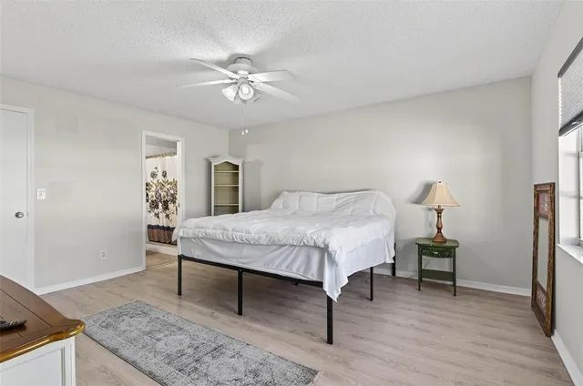 a bedroom with a bed and a table in it