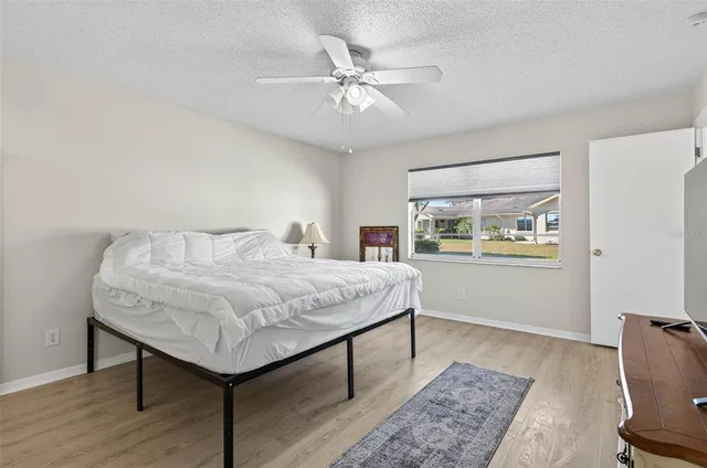 a bedroom with a bed and a table