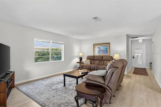 a living room with furniture and a window
