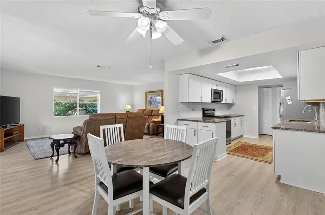 a view of kitchen with cabinets and wooden floor