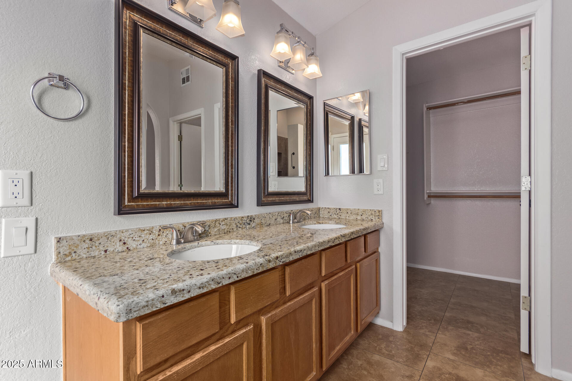 208 East Devon Drive Gilbert, AZ 85296 - Photo 17 of 37 a bathroom with a granite countertop sink and a mirror
