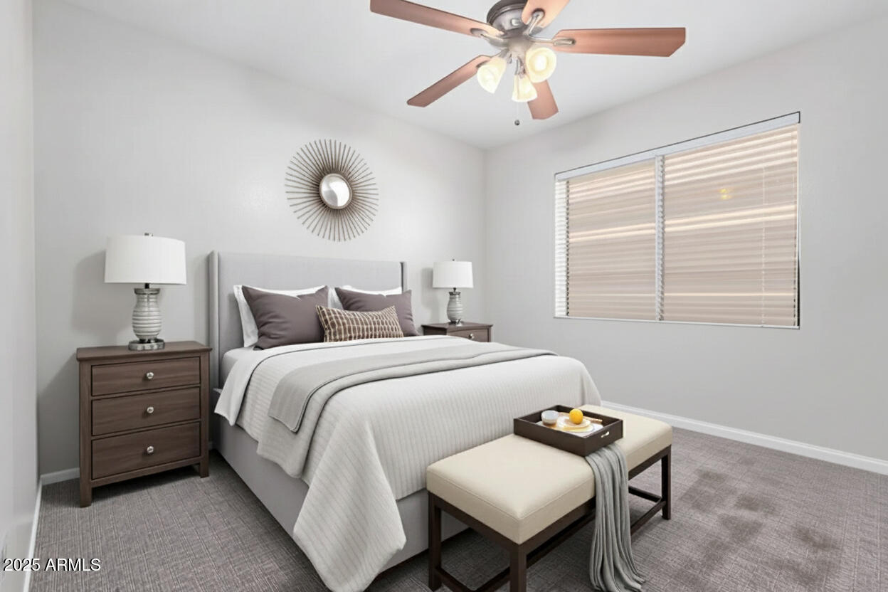 208 East Devon Drive Gilbert, AZ 85296 - Photo 20 of 37 a bedroom with a bed and a chandelier