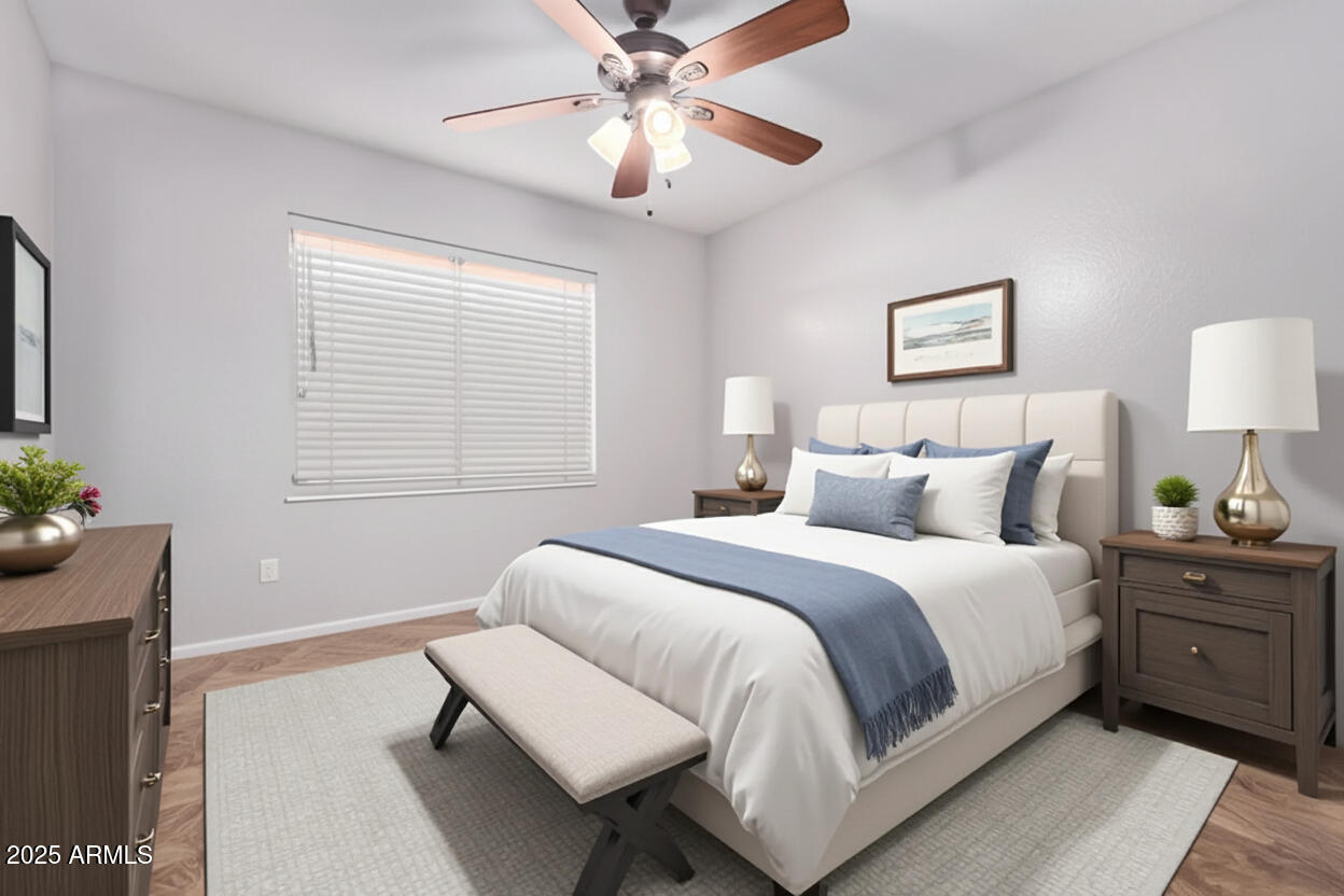 208 East Devon Drive Gilbert, AZ 85296 - Photo 26 of 37 a bedroom with a bed and a chandelier