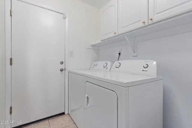 a bathroom with a granite countertop toilet a sink and a mirror