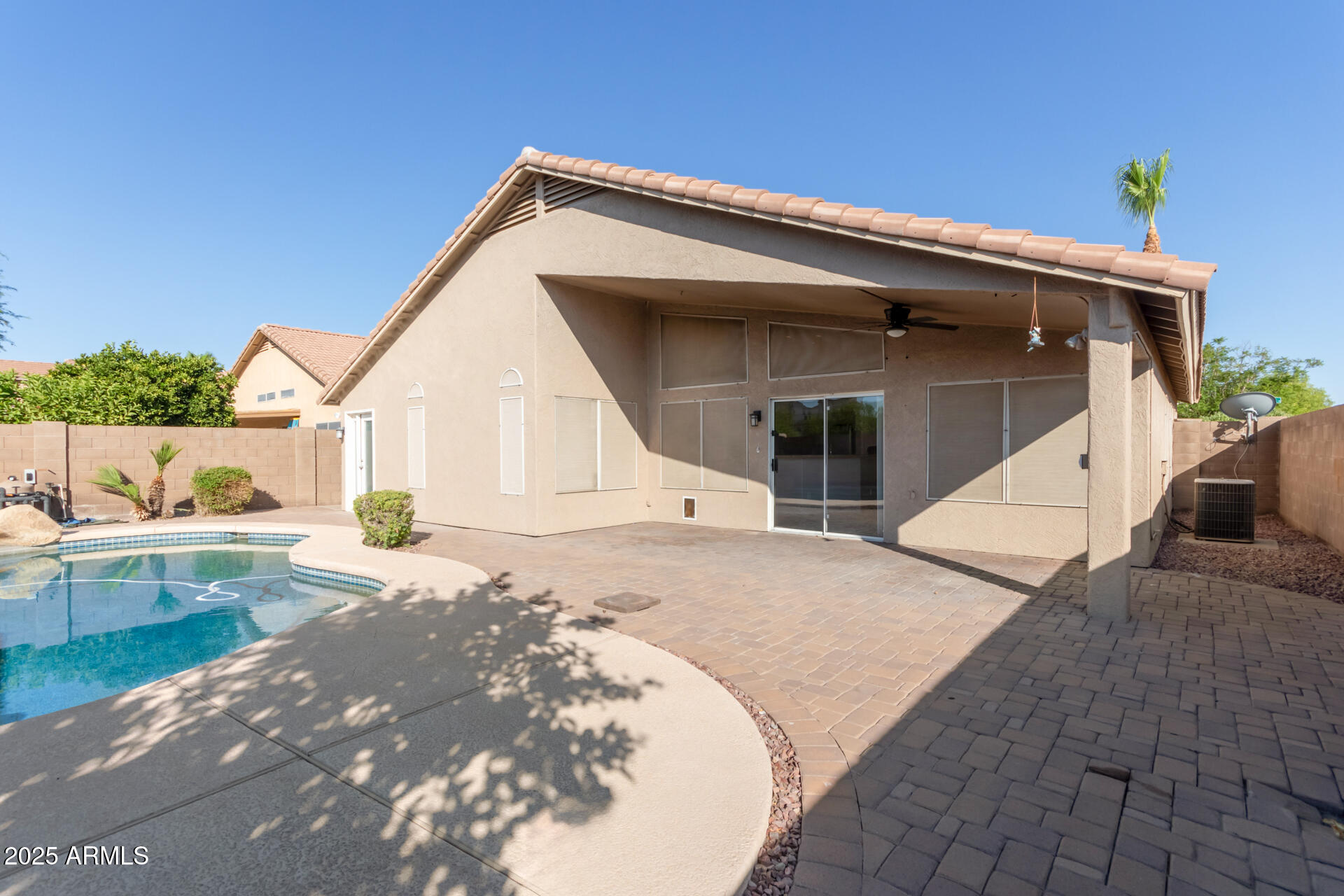 208 East Devon Drive Gilbert, AZ 85296 - Photo 33 of 37 a view of a house with backyard and swimming pool
