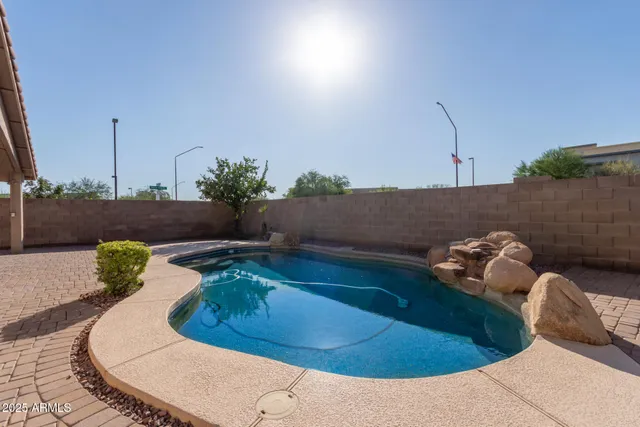 a view of a terrace with a table and chairs