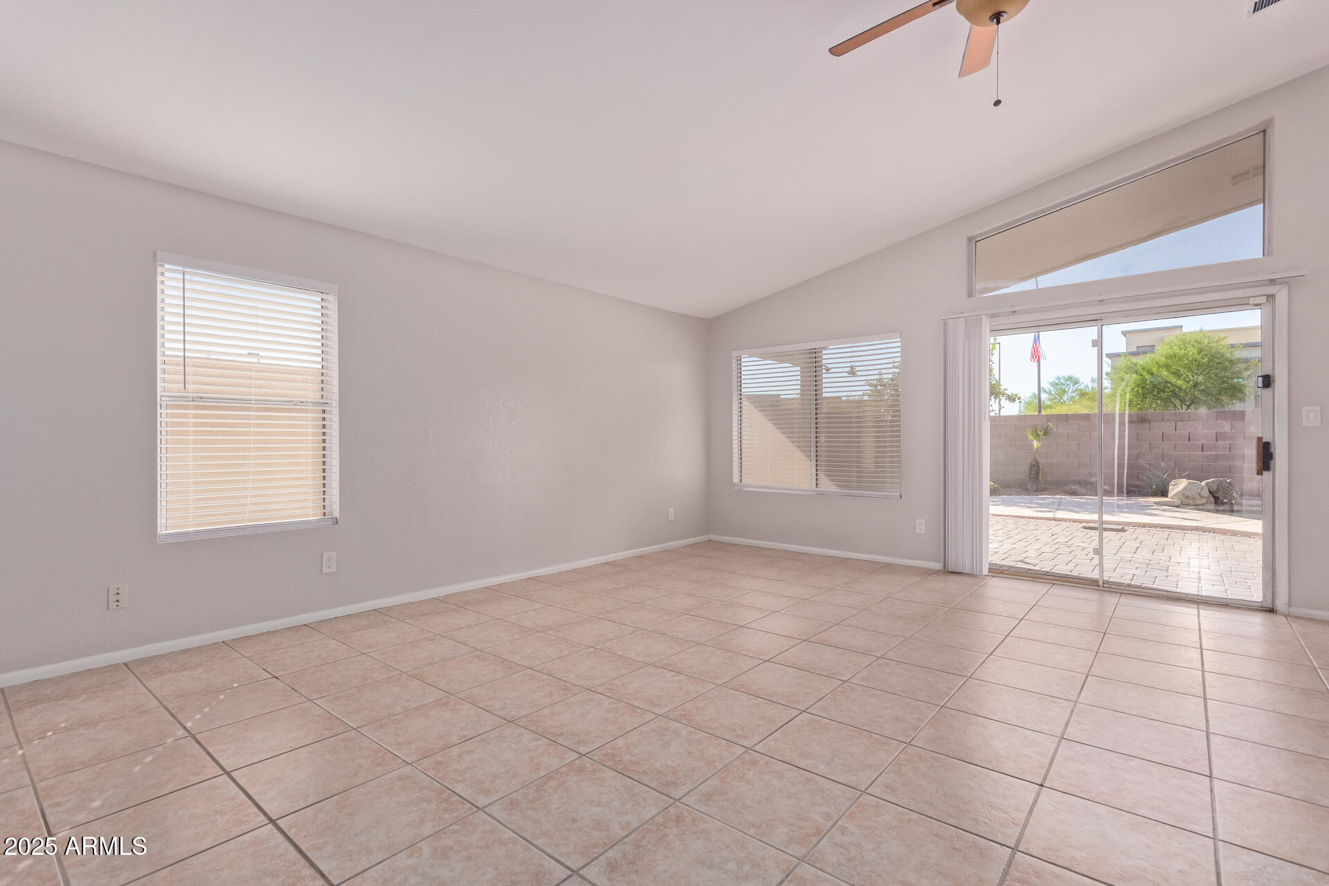 208 East Devon Drive Gilbert, AZ 85296 - Photo 6 of 37 a view of an empty room with a window