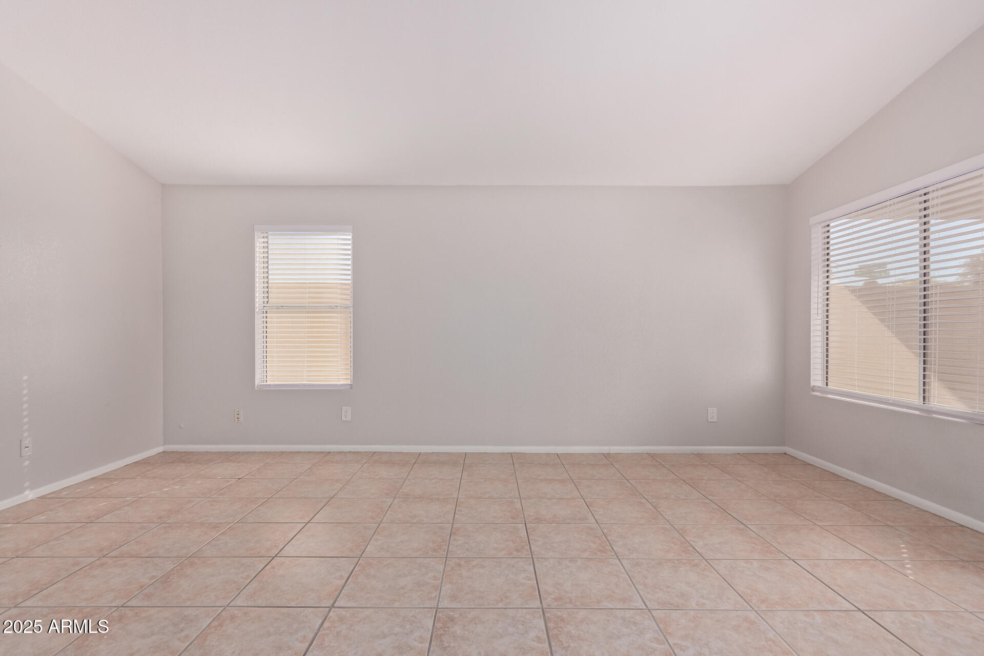 208 East Devon Drive Gilbert, AZ 85296 - Photo 8 of 37 an empty room with windows