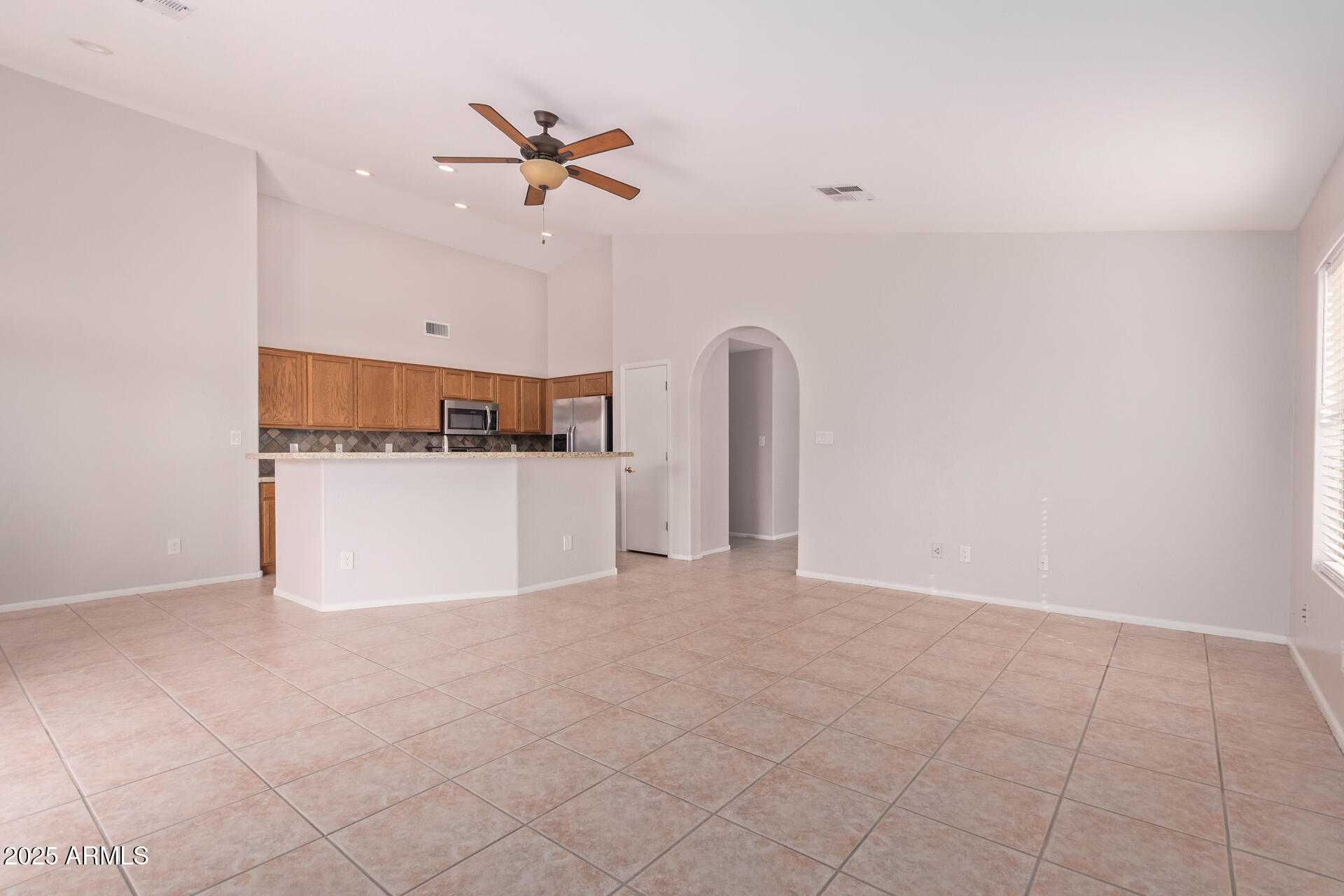 208 East Devon Drive Gilbert, AZ 85296 - Photo 9 of 37 a view of a kitchen with a sink and a refrigerator