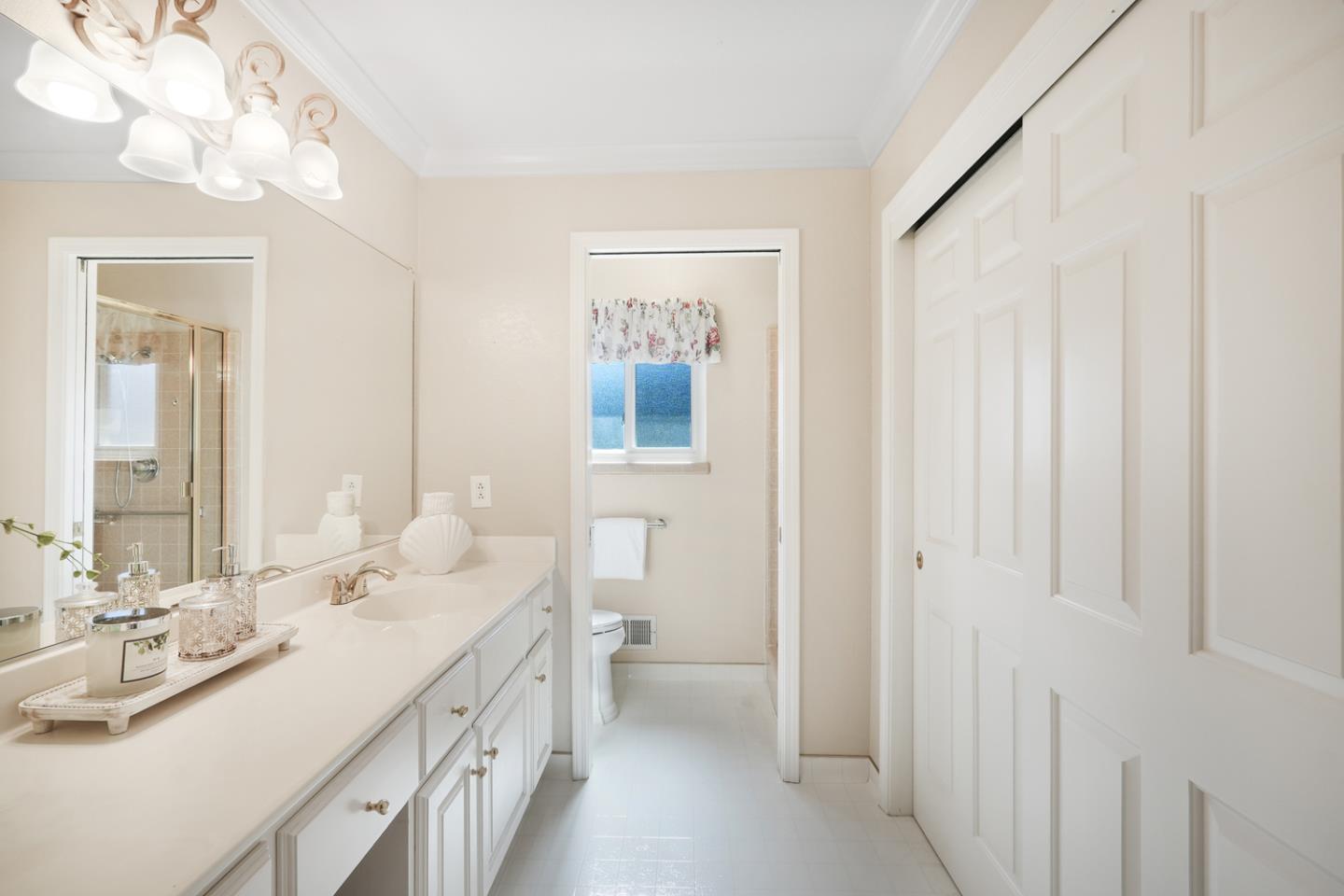 19573 Almaden Road San Jose, CA 95120 - Photo 18 of 41 a bathroom with a double vanity sink and a mirror
