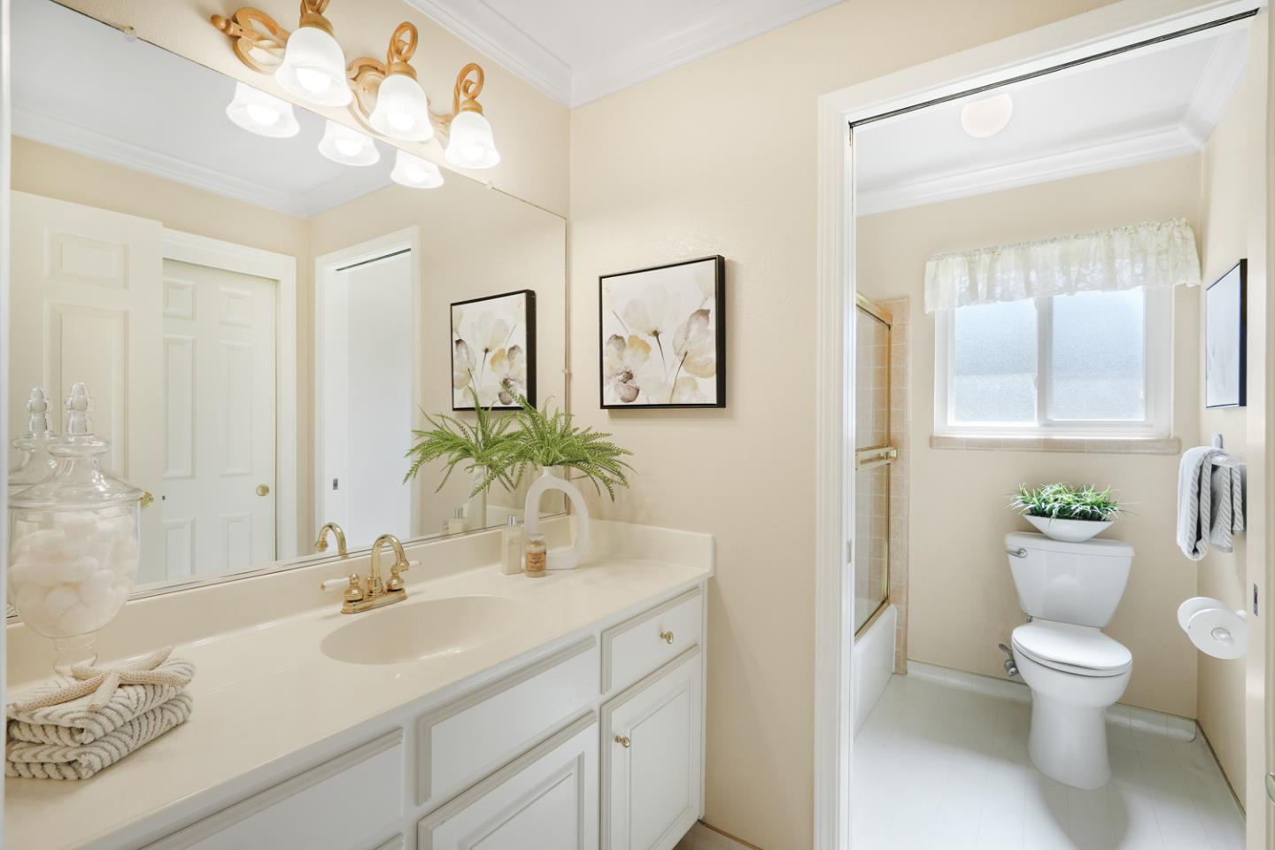 19573 Almaden Road San Jose, CA 95120 - Photo 19 of 41 a bathroom with a toilet a sink a large mirror and vanity