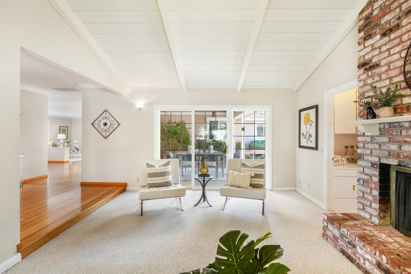 19573 Almaden Road San Jose, CA 95120 - Photo 5 of 41 a living room with furniture a fireplace and a flat screen tv