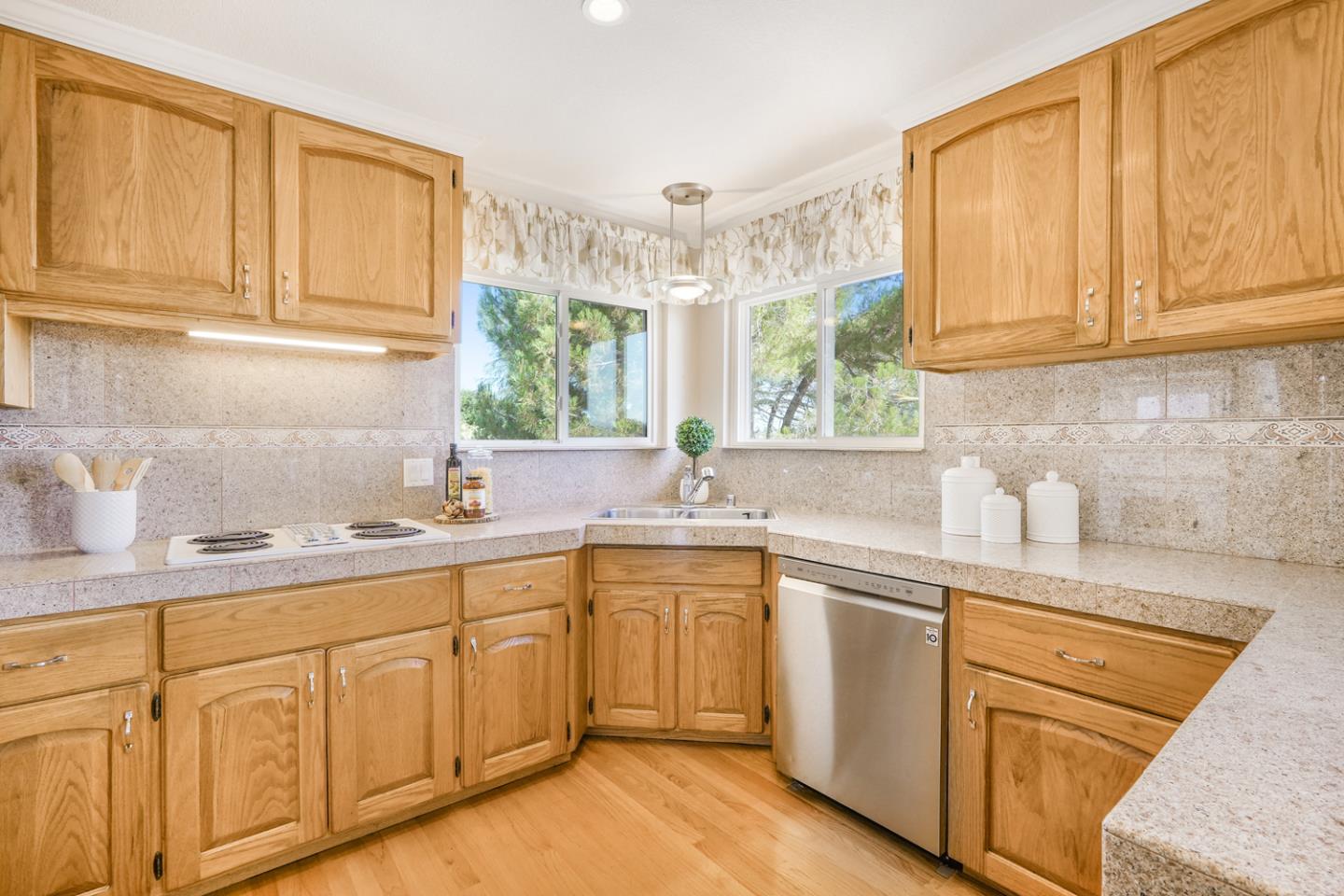 19573 Almaden Road San Jose, CA 95120 - Photo 8 of 41 a kitchen with cabinets appliances a sink and a window