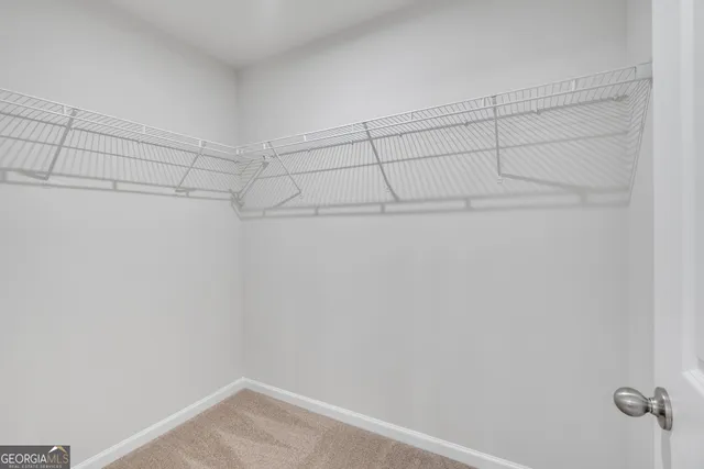 a view of a room with racks on the wall