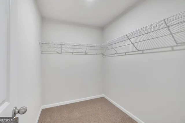 a view of a room with racks on the wall